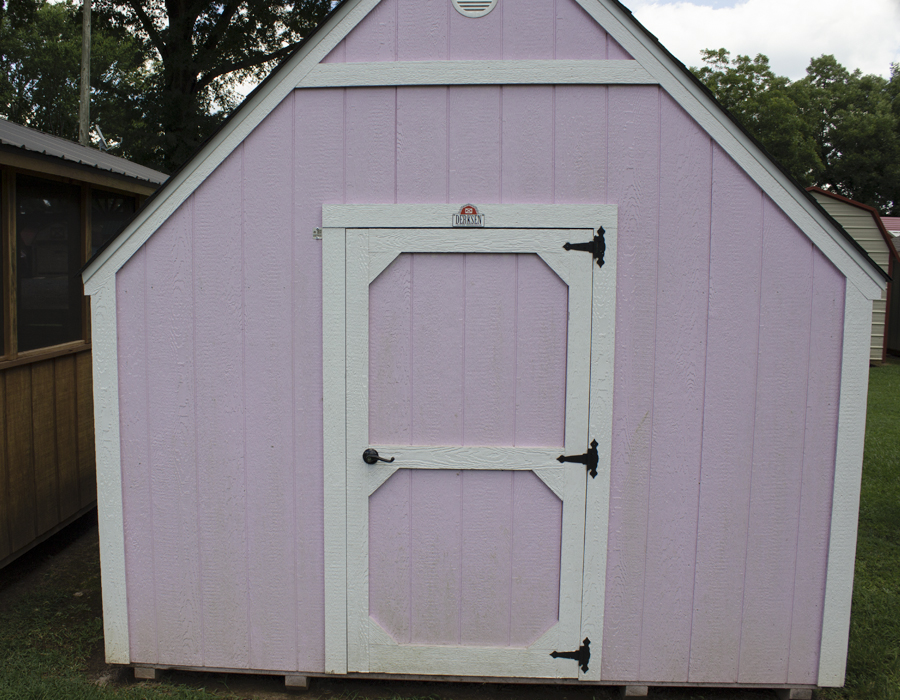 Village Barns - pink playhouse with barn door