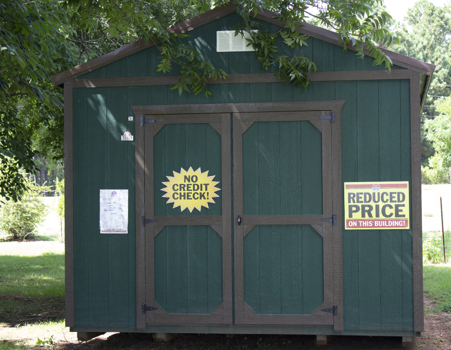 Village Barns - green utility shed at reduced price